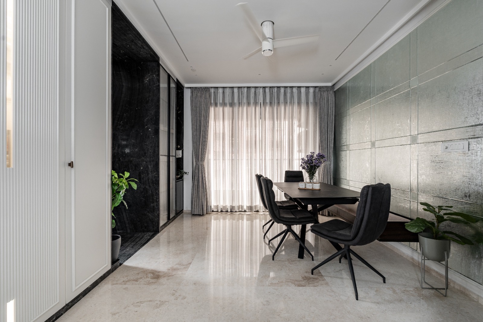 Pinch-pleat drapes layered over sheer curtains in a Bengaluru dining room, supplied and installed by SPACIYOUS
