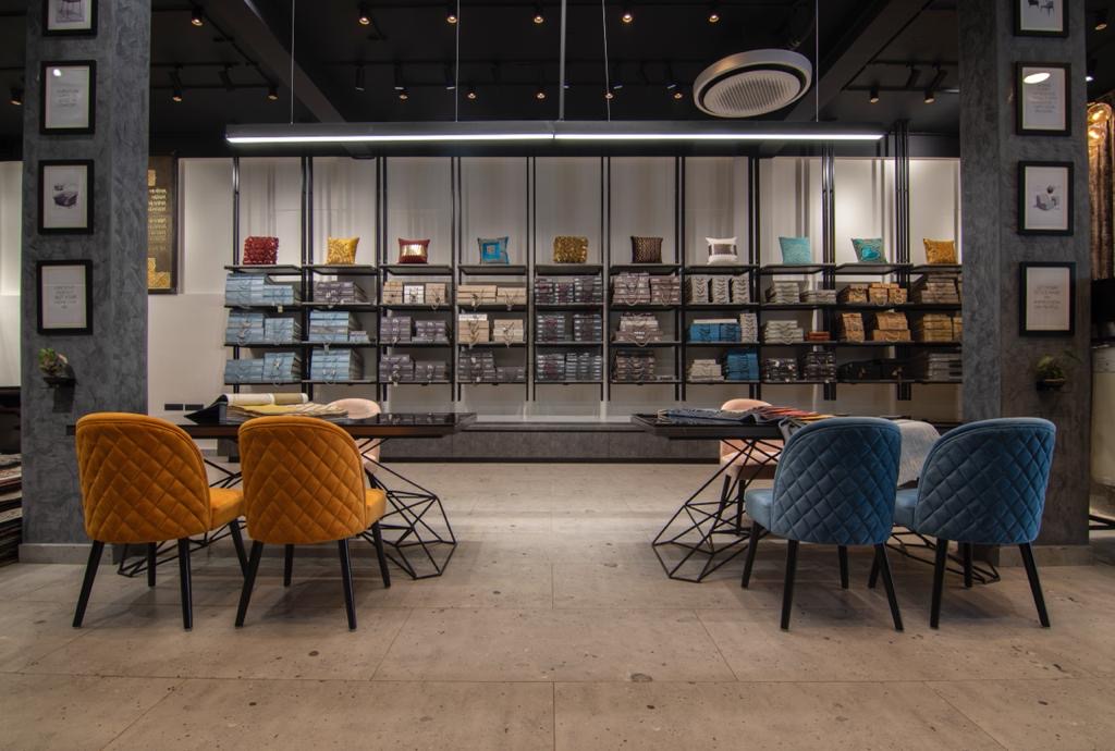 Consultation tables set between sample shelves